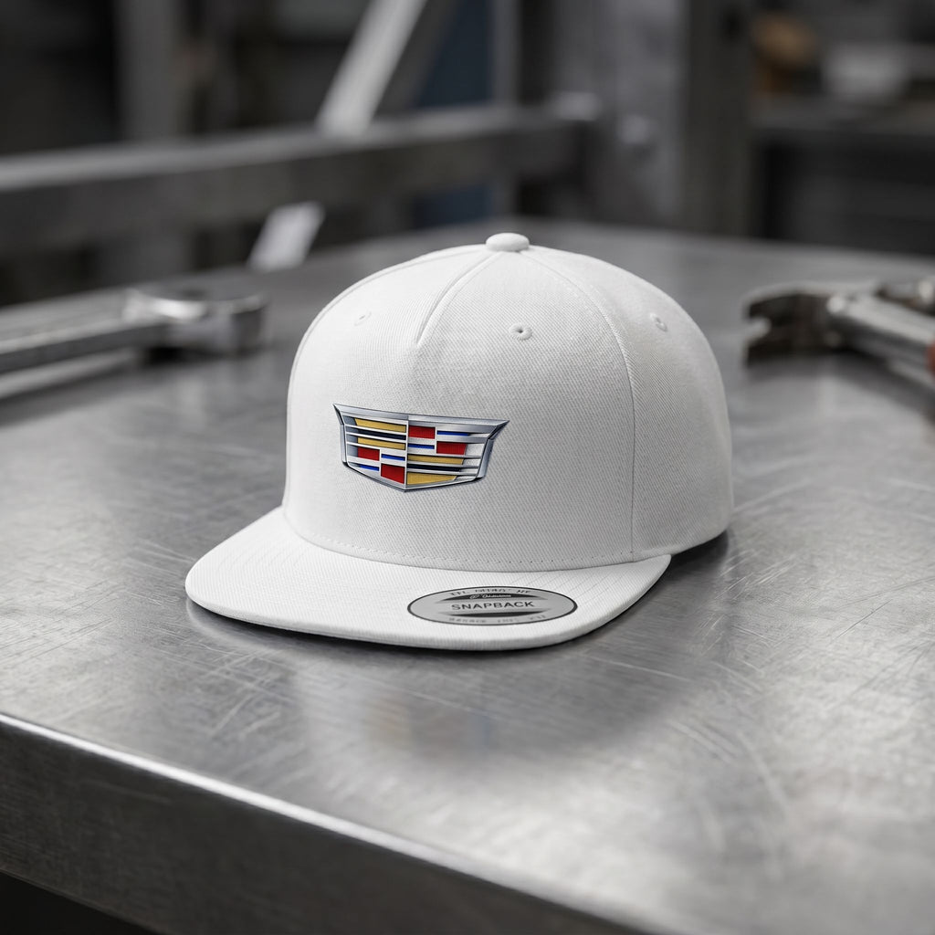 Tiny Cadillac Car Snapback Hat with detailed cotton fabric on a brushed metal surface, photographed from above with soft diffuse lighting.