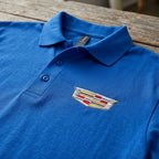 Close-up of men's Cadillac Car Dry Blend Polo highlighting textured knit fabric, welt collar, dyed-to-match buttons, and craftsmanship.