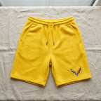 High-resolution close-up of laid-flat Chevrolet Corvette fleece shorts, highlighting fabric weave, stitching, and craftsmanship.