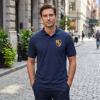 Full-body shot of a man wearing the white Porsche Car Dry Blend Polo on a city street with relaxed posture and urban background.