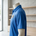 Polo on mannequin highlighting lightweight, smooth polyester fabric with reinforced seams in a bright retail space.