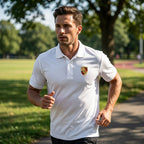 Action shot of man wearing men's Porsche polyester polo during outdoor activity, demonstrating moisture-wicking fabric.