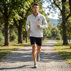 Full-body view of men’s Porsche performance shirt worn during outdoor activity, highlighting fit, stretch fabric, and moisture-wicking qualities.