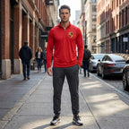 Full-body view of man wearing Porsche athletic shirt on city sidewalk, showcasing the modern fit and stretch fabric.