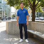 Full-body view of men's Cadillac Car Dry Blend Polo worn by a male model in an urban environment.