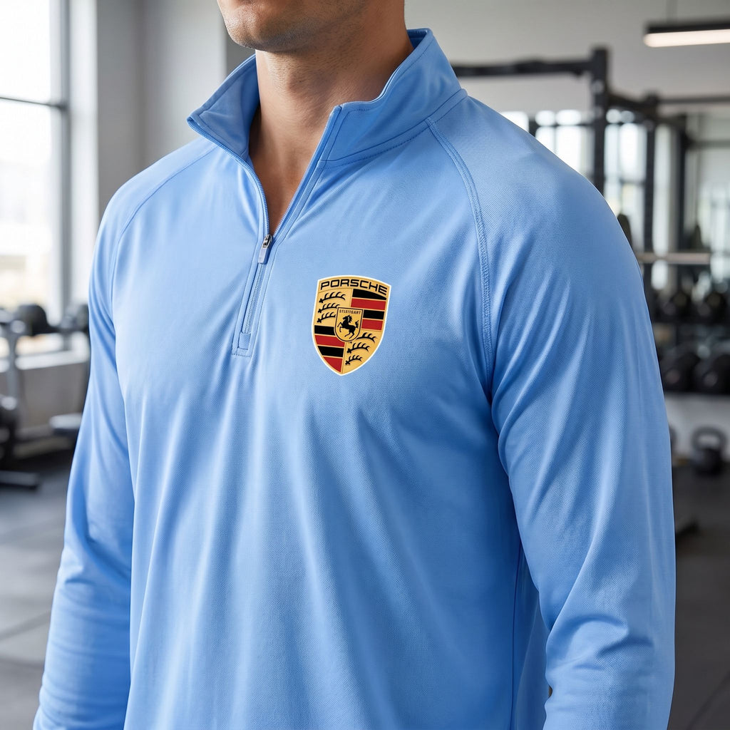 Close-up of men's Porsche-inspired quarter-zip athletic shirt showing breathable polyester fabric texture and stitching.