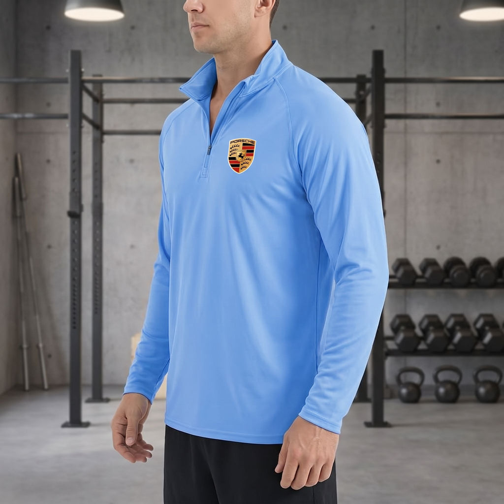 Side profile of man in Porsche quarter-zip shirt in gym, focusing on fit, ventilation, and lightweight fabric.
