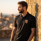 Male model in Men’s Porsche Polo during golden hour, urban background with natural highlights.