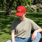 Model wearing small Cadillac Car Dad Baseball Cap outdoors in a park with natural sunlight and relaxed style.