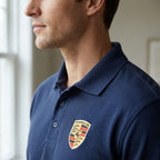 Close-up profile of Porsche Car Dry Blend Polo collar and placket, emphasizing crisp stitching and structure in diffused indoor light.