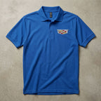Studio flat lay of men's Cadillac Car Dry Blend Polo on neutral textured background, showcasing fabric details, stitching, and neat design.