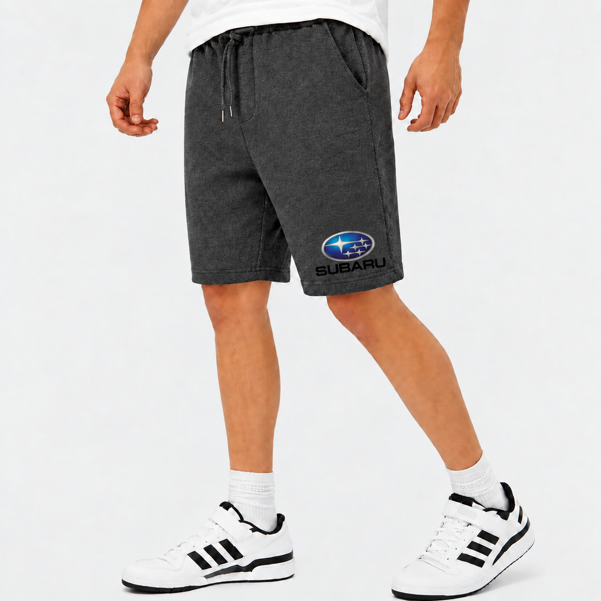 Subaru shorts Charcoal logo near lower left leg hem