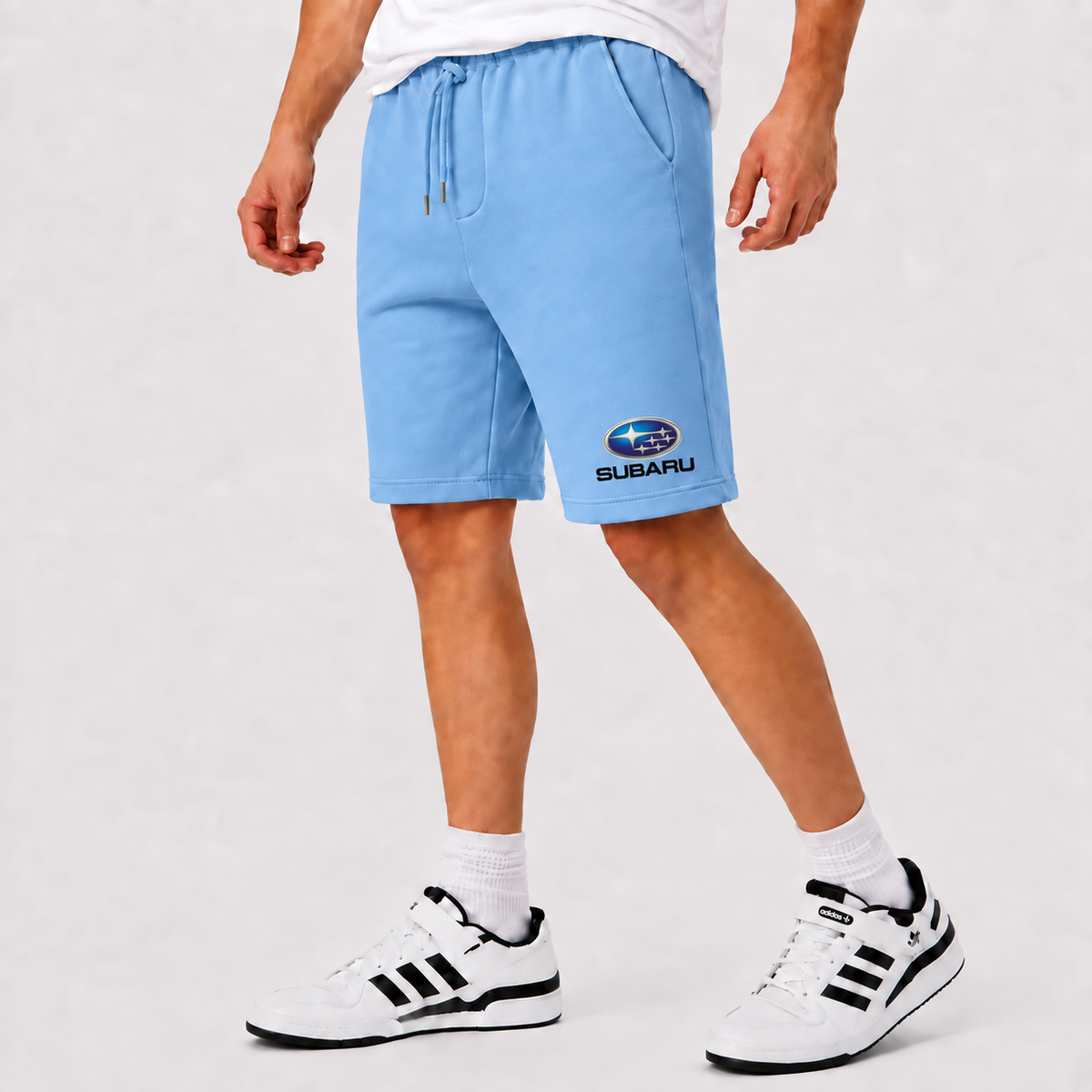 Subaru shorts Sky Blue logo near lower left leg hem